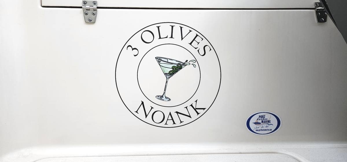 Custom martini graphic and boat name lettering on a transom