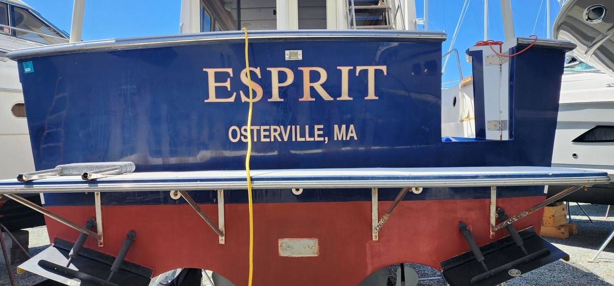 Boat transom with the previous name before re-lettering