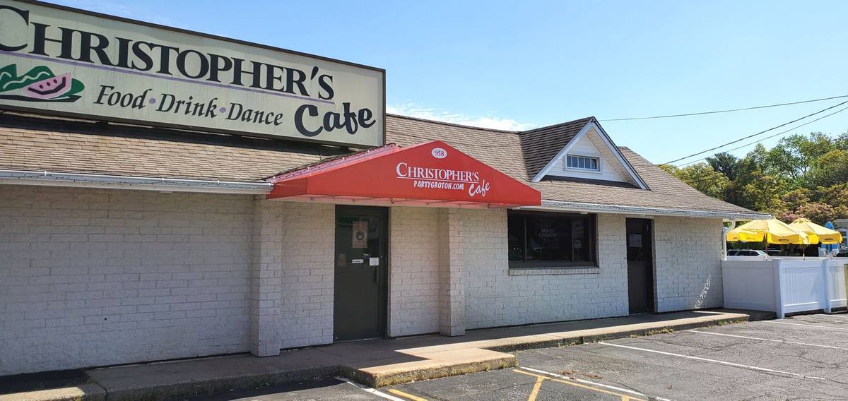 Christopher's Cafe storefront with red branded awning and sign