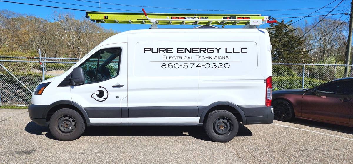 Pure Energy LLC white work van with cut vinyl business lettering