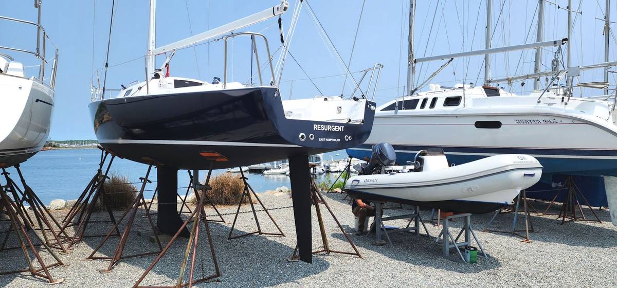 Sailboat hull after navy blue color change vinyl wrap